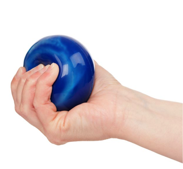 A hand compressing a rubber ball